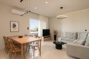 a living room with a table and a couch at Casa delle Palme in Rethymno Town