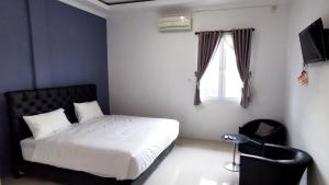 Afbeelding uit fotogalerij van Hotel Aqiilah Syariah in Lamongan