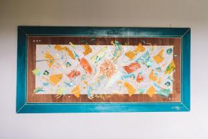 a picture of a quilt with fish on it at Bungalow de Nola in Le Lamentin