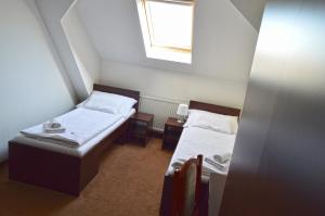 En eller flere senger på et rom på Penzion Batovka u Hoffera