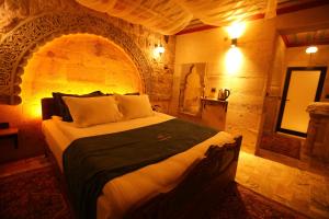 Postel nebo postele na pokoji v ubytování Akritis Cappadocia House