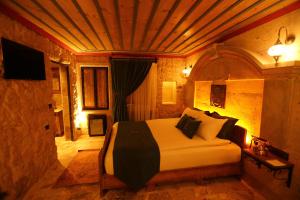 Postel nebo postele na pokoji v ubytování Akritis Cappadocia House