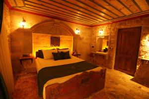 Postel nebo postele na pokoji v ubytování Akritis Cappadocia House