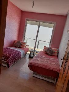 Katil atau katil-katil dalam bilik di Atlantic Beach View Villa