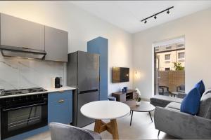 A kitchen or kitchenette at The Archer Aparthotel by Totalstay