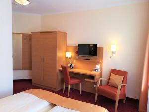 TV a/nebo společenská místnost v ubytování Hotel Villa Meeresgruss