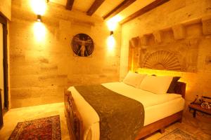 Postel nebo postele na pokoji v ubytování Akritis Cappadocia House
