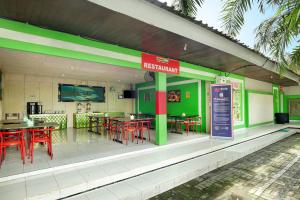 Restoran või mõni muu söögikoht majutusasutuses Negara Hotel - CHSE Certified