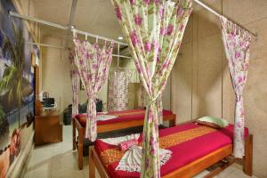 Voodi või voodid majutusasutuse Negara Hotel - CHSE Certified toas