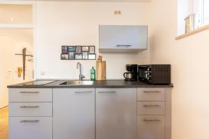 Kuchyň nebo kuchyňský kout v ubytování Serviced Appartement München Messe