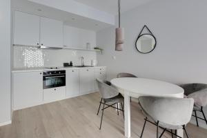 Virtuve vai virtuves zona naktsmītnē Comfort Apartments Grano Residence