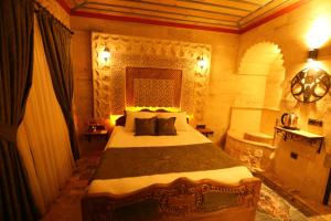 Postel nebo postele na pokoji v ubytování Akritis Cappadocia House
