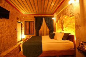Postel nebo postele na pokoji v ubytování Akritis Cappadocia House