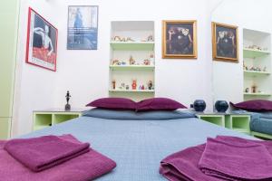 Un pat sau paturi într-o cameră la DomusAmor Navona