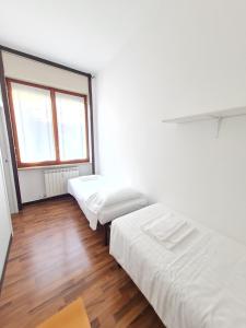 Voodi või voodid majutusasutuse BRERA - ForoBuonaparte Cozy apartment toas
