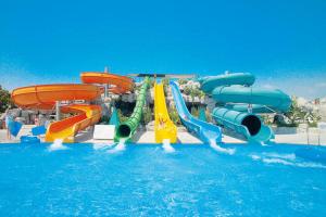 a water park with a water slide in the water at DEMI108 in Brežice