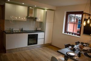 a kitchen with a table and a dining room at DEMI108 - Terme čatež in Čatež ob Savi