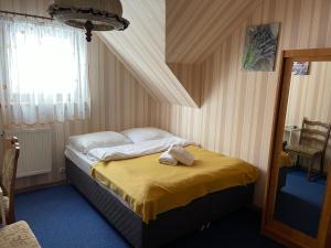 Łóżko lub łóżka w pokoju w obiekcie Agropajda