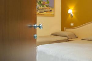 Postel nebo postele na pokoji v ubytování Hotel Orion