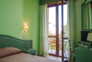 Postel nebo postele na pokoji v ubytování Hotel Orion