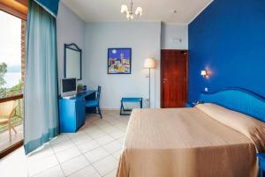 Postel nebo postele na pokoji v ubytování Hotel Orion