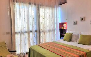 A bed or beds in a room at Casa Alice