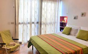 A bed or beds in a room at Casa Alice