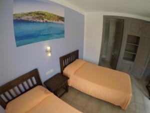 מיטה או מיטות בחדר ב-Hostal Playa