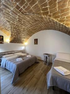 Posteľ alebo postele v izbe v ubytovaní L Antico Soffitto Tropea