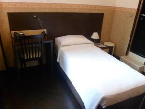 Postel nebo postele na pokoji v ubytování Hotel Liberty