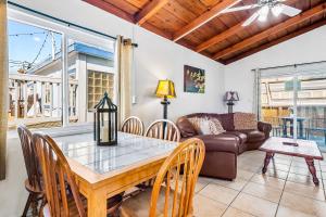 a living room with a table and a couch at Mimi's and Nana's Beach House in San Diego