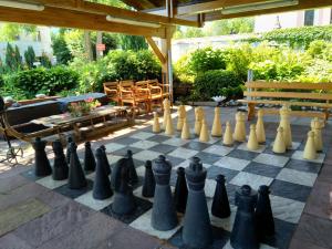 a chessboard is sitting on a patio at Schlossberghof Marzoll in Bad Reichenhall