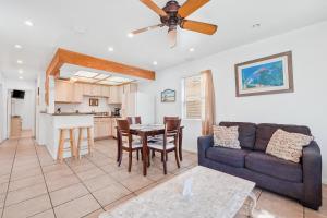 a living room with a couch and a table at Mike's Place at the Beach in San Diego