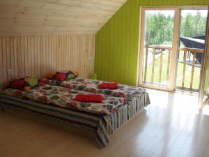 Postel nebo postele na pokoji v ubytování Kõveri Holiday Center