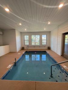 a large indoor swimming pool in a building at Big Pine Chalet in Waldens Creek
