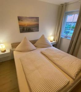 Ένα ή περισσότερα κρεβάτια σε δωμάτιο στο Lüttje Friesenhuus