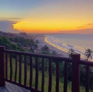 a view of the beach at sunset from a balcony at EDEN Pousada in Lagoinha +15 photos
