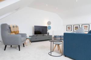 Et tv og/eller underholdning på Edinburgh Deluxe Duplex with Garage