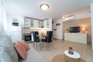 TV a/nebo společenská místnost v ubytování Marjan Apartment