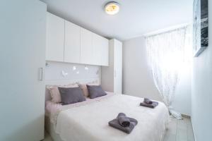 Postel nebo postele na pokoji v ubytování Marjan Apartment