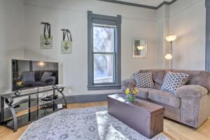 a living room with a couch and a table at Quaint Helena Apartment - Walkable to Downtown! in Helena