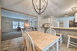 a dining room and kitchen with a table and chairs at Spacious Wellston Home Near Hiking and Skiing! in Wellston