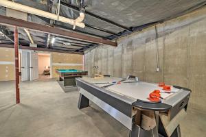 a large room with a pool table in it at Spacious Wellston Home Near Hiking and Skiing! in Wellston