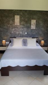 Ένα ή περισσότερα κρεβάτια σε δωμάτιο στο Βίλλα Ίκαρος +34 φωτογραφίες