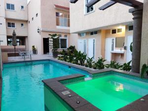 a swimming pool in the backyard of a house at Hotel Casa Garatusa in Yuriria