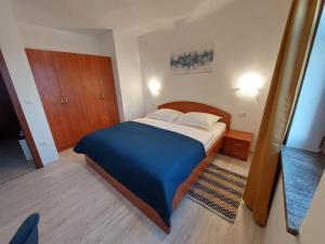 Postel nebo postele na pokoji v ubytování Apartments Amfora