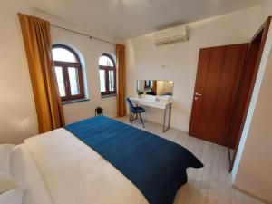 Postel nebo postele na pokoji v ubytování Apartments Amfora