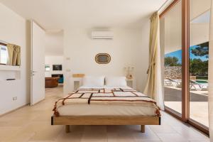 Postel nebo postele na pokoji v ubytování Borgo Maresca by Perle di Puglia