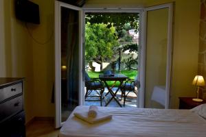 Кровать или кровати в номере Delfini Resort