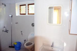 Koupelna v ubytování ARYA HOMESTAY BOUGAIN VILLA